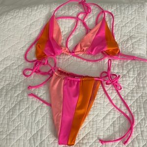 Block colors Tiga bikini set size M m/l. Never worn/perfect condition, no tags